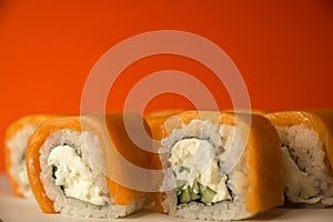 Close-up of Japanese sushi made from salmon, rice, cucumber, cheese. Japanese restaurant with traditional cuisine. Sushi Macron Br photo