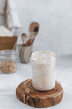 Close-up of jar with natural homemade sourdough levain starter for homemade bakery