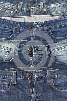 It is a close up of jeans pile