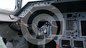 Close up of jet's dashboard control equipped with multiple electronic displays, communication and navigation systems