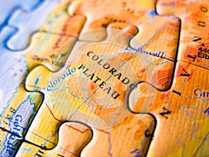Close up of a jigsaw puzzle map depicting Colorado Plateu