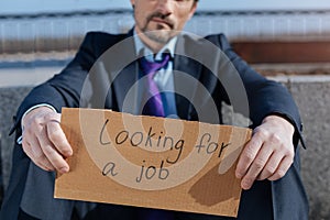 Close up of jobless man looking for new work