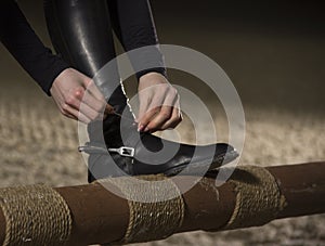 Close up of jockey preparing for the horseback riding.Equestrian sport