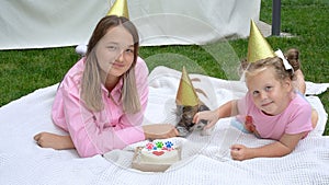 Close-up Joyful children celebrating their dog\'s birthday with tasty cake .