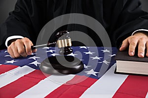 Judge Hands With Gavel And American Flag