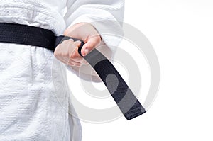 Close up of judo uniform, judo-gi, with belt isolated on white