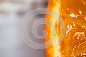 Close up of juicy orange slice with peel