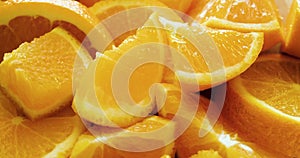 Close-up of juicy ripe orange slices on a large plate.