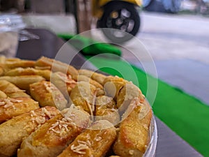 A close up of Kaasstengels, Kastengel or Cheesecake.  pastries that are usually served during Eid in Indonesia