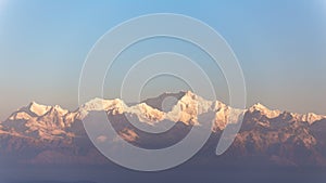 Close-up Kangchenjunga mountain in the morning with blue and orange sky that view from The Tiger Hill in winter at Tiger Hill. photo
