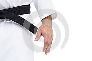 Close-up of karate black belt on white uniform