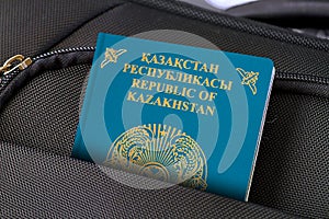 Close up of Kazakhstan Passport in Black Suitcase Pocket