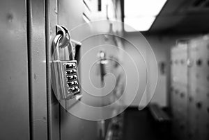 Close up key of lockers in gym, school and plant in black and white