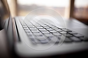 Close-up of the keyboard of an open laptop ready to work.