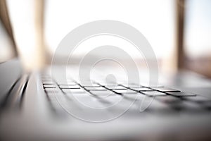 Close-up of the keyboard of an open laptop ready to work.