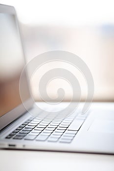 Close-up of the keyboard of an open laptop ready to work.