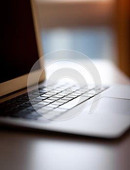 Close-up of the keyboard of an open laptop ready to work.