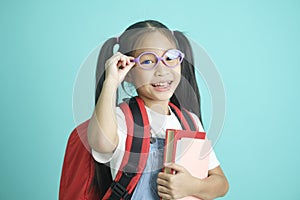 Close-up kid schoolgirl wearing glasses, she nice cute attractive cheerful amazed.