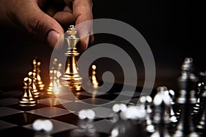 Close up king chess challenge or battle fighting with falling chess on chess board concepts of leadership