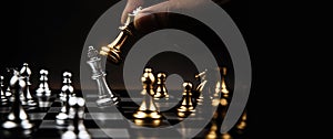 Close up king chess challenge or battle fighting with falling chess on chess board concepts of leadership