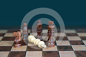 Close-up king chess stand on falling chess concepts of competition challenge of leader business team or teamwork volunteer or