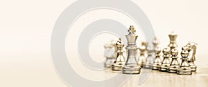 Close-up king chess stand with queen on chessboard concepts of leader teamwork volunteer challenge of business team or wining and