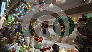 Close-up of kiosk at Christmas market in Munich, Germany. Christmas ornaments at holiday fair. Selling festivities