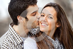 Close up kiss on girls cheek.