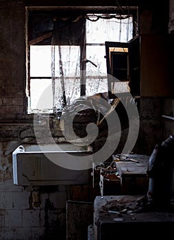 Close up of kitchen left in appalling condition in derelict 1930s deco house. Rayners Lane, Harrow UK