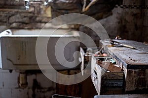 Close up of kitchen left in appalling condition in derelict 1930s deco house. Rayners Lane, Harrow UK