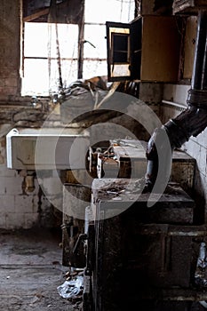 Close up of kitchen left in appalling condition in derelict house. Harrow UK