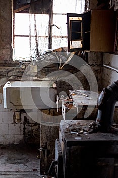 Close up of kitchen left in appalling condition in derelict house. Rayners Lane, Harrow UK photo