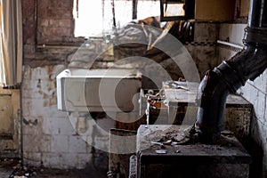 Close up of kitchen left in appalling condition in derelict house. Rayners Lane, Harrow UK