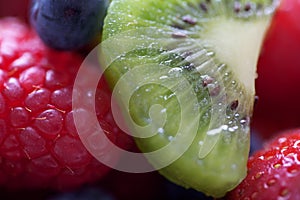 Close up of kiwi, raspberry and blueberry