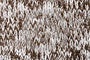 Close up on knit woolen fabric texture.