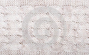 Close up on knit woolen fabric texture.