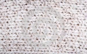 Close up on knit woolen fabric texture.