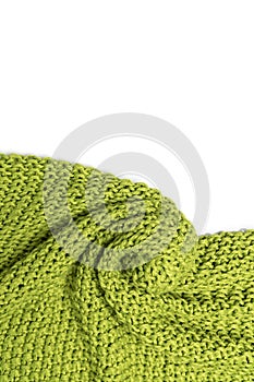 Close-up of knitted wool blanket on white background.