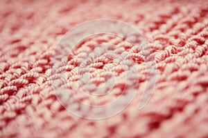 Close up of knitting dirty-pink textured wool background, vintage style