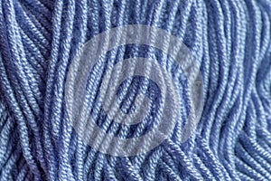 Close-up, knitting texture. The violet thread and knitting.