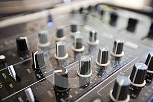 Close up of knobs on audio console photo