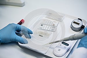 Close up of lab technician preparing blood test