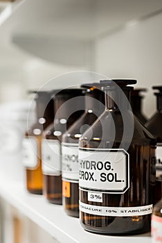 Close-up of the labeled glass container of a chemical pharmaceut