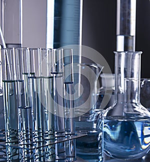 Close up of labware such as beaker, flask, graduated cylinders and test tubes well placed