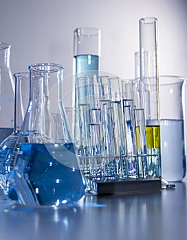 Close up of labware such as beaker, flask, graduated cylinders and test tubes well placed