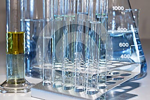 Close up of labware such as beaker, flask, graduated cylinders and test tubes well placed