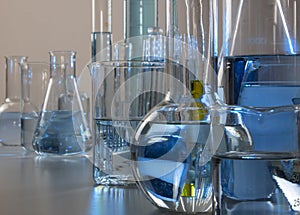 Close up of labware such as beaker, flask, graduated cylinders and test tubes well placed