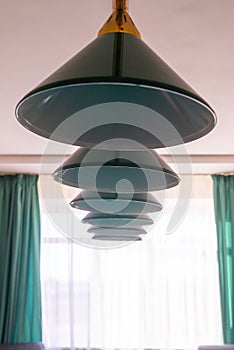 Close up of lamps hang over billiard table