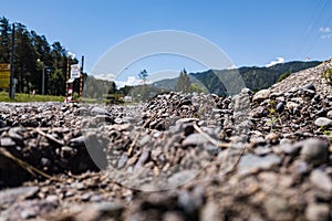 Close-up of a land with stones during cultivation planting seeds for growing crops and agriculture. Barren soil