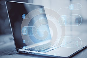 Close up of laptop with abstract big data and security nodes on blurry background. Technology, web safety and programming concept